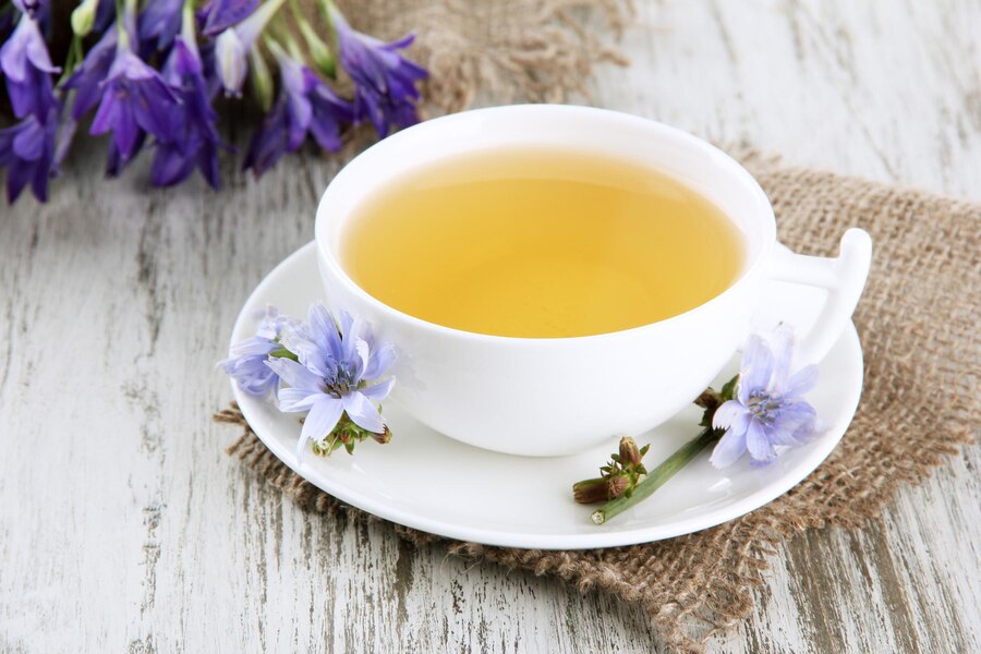 cup-of-tea-with-chicory-on-wooden-background_392895-246501.jpg